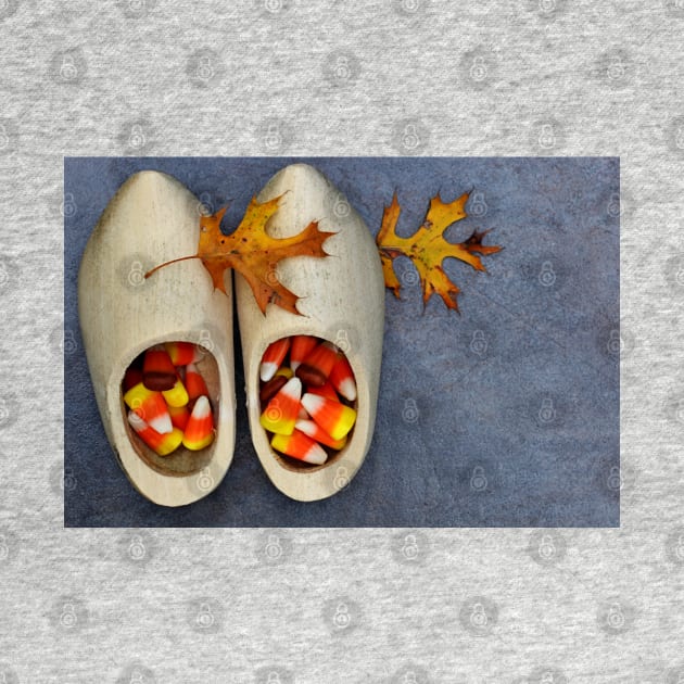 Wooden Dutch shoes with candy corn and oak leaves. by ikshvaku